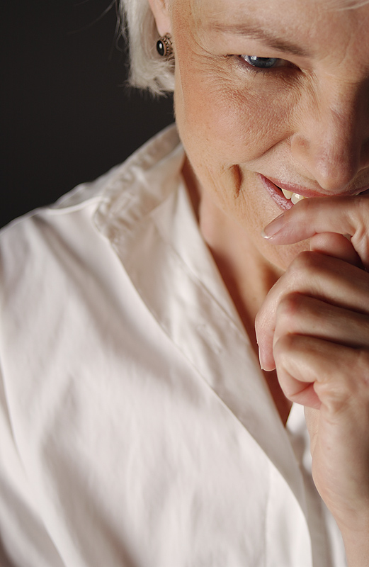 Photo of woman covering a laugh, as Sarah laughed when God said she would have a son in her old age